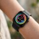 Smartwatch on a wrist showing health stats
