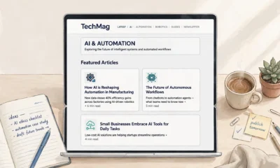 Laptop showing a tech magazine homepage with AI and automation article cards