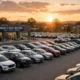 Car dealership lot at sunset — Westlake Financial auto financing guide