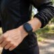 Smartwatch on a wrist while jogging outdoors